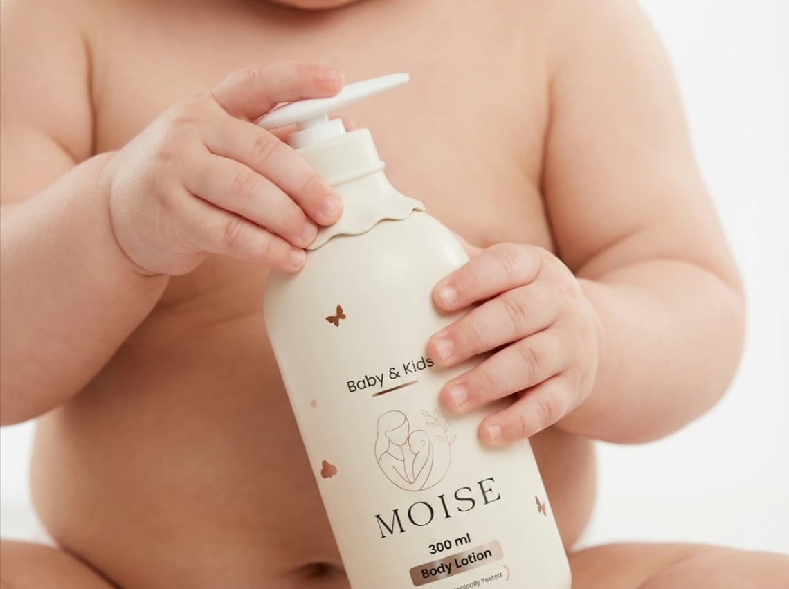 Baby with body lotion