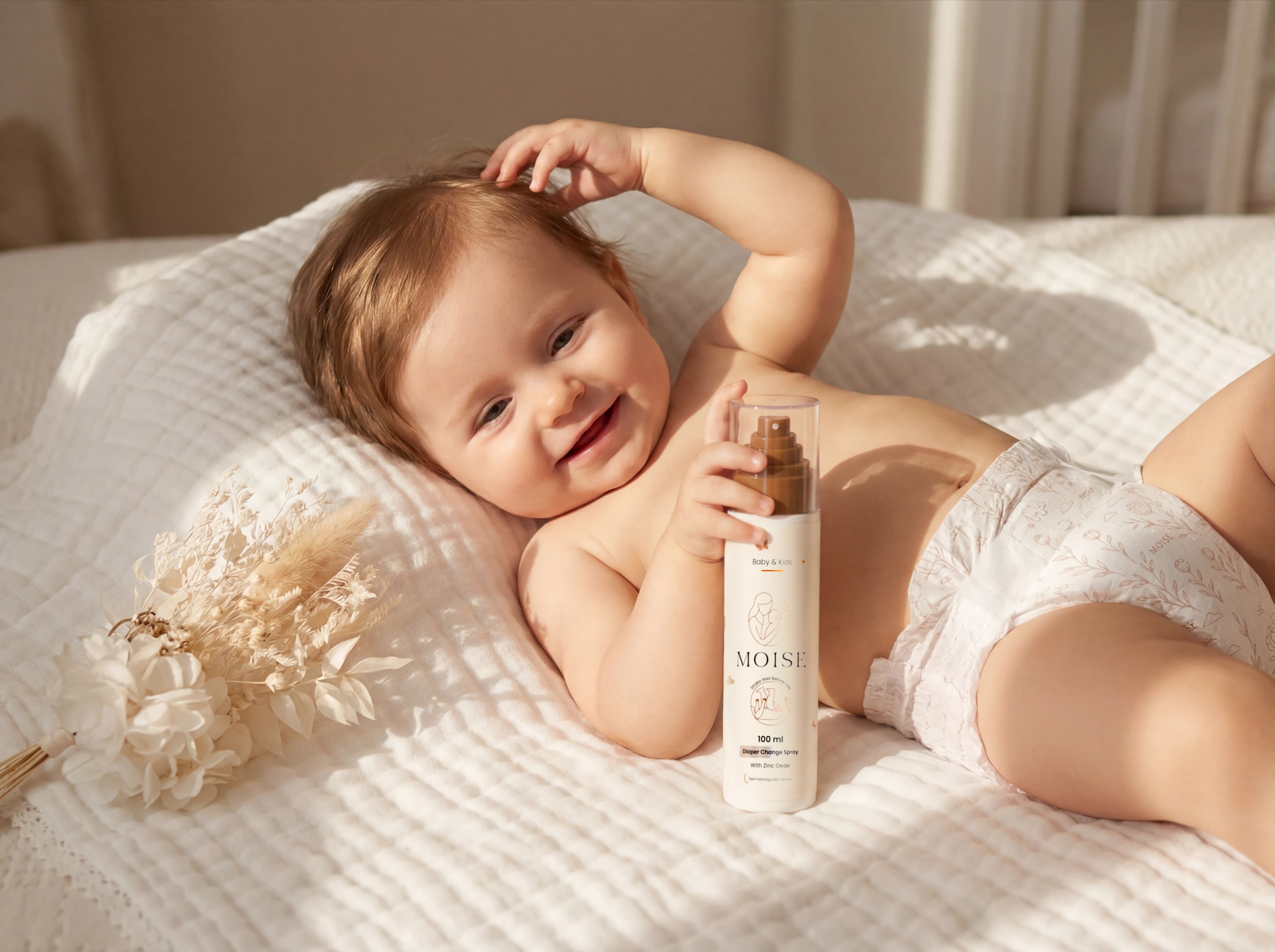 Baby with luierspray